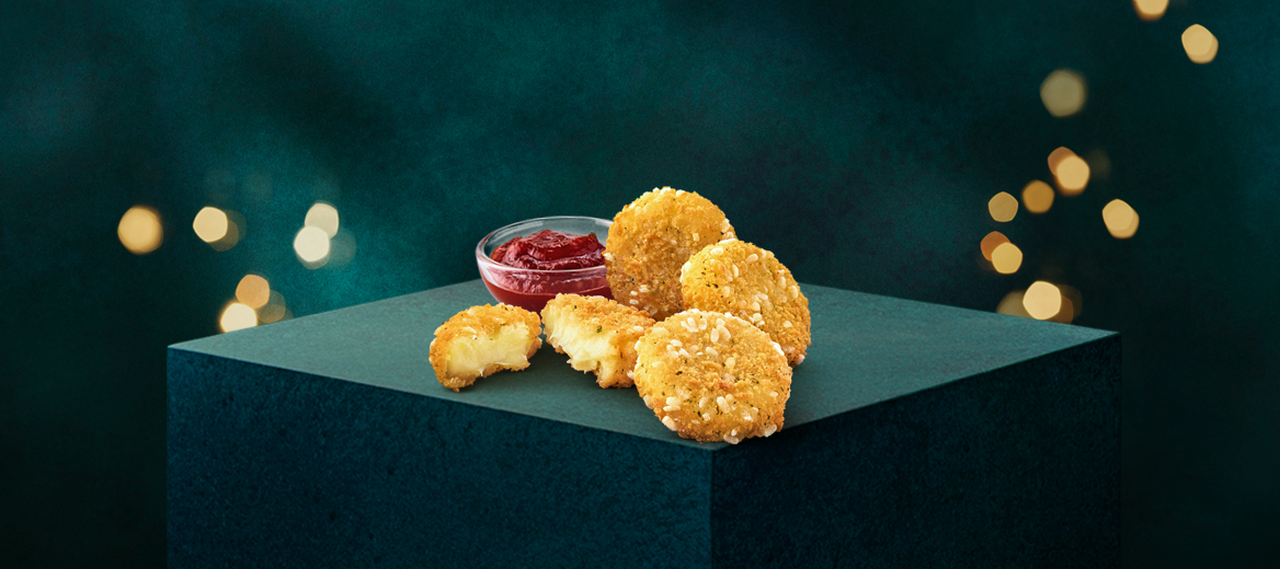 Cheese Melt Dippers with Rich Tomato Dip with a festive dark green background