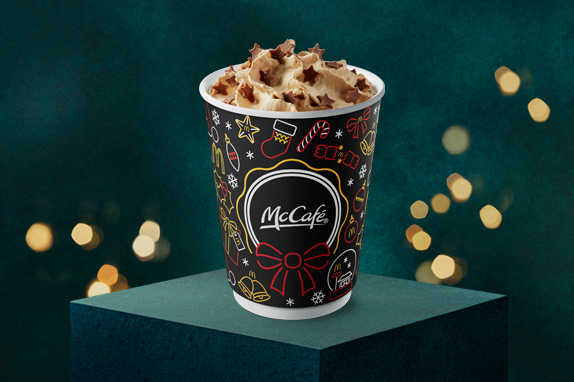 Galaxy® Caramel Latte with a festive dark green background