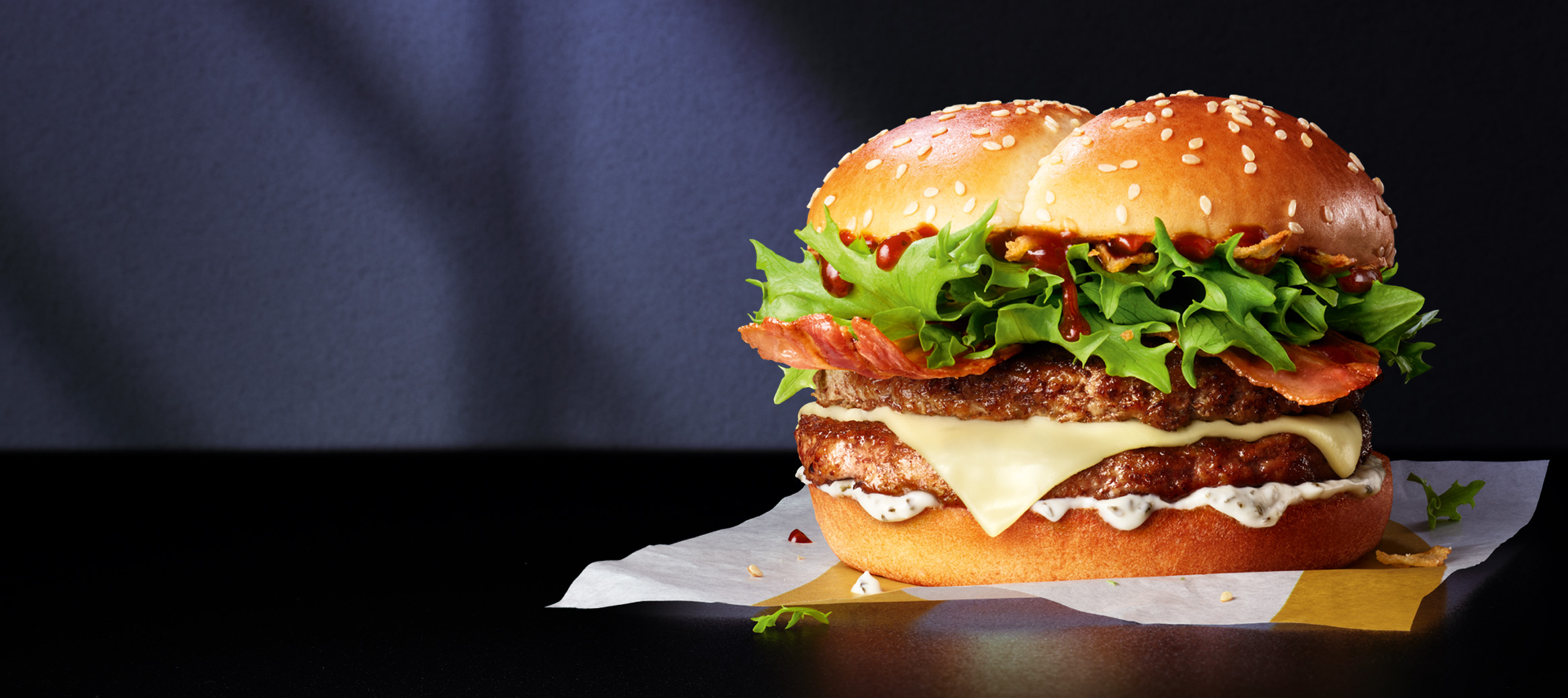 BBQ Ranch Stack burger on top of a black table