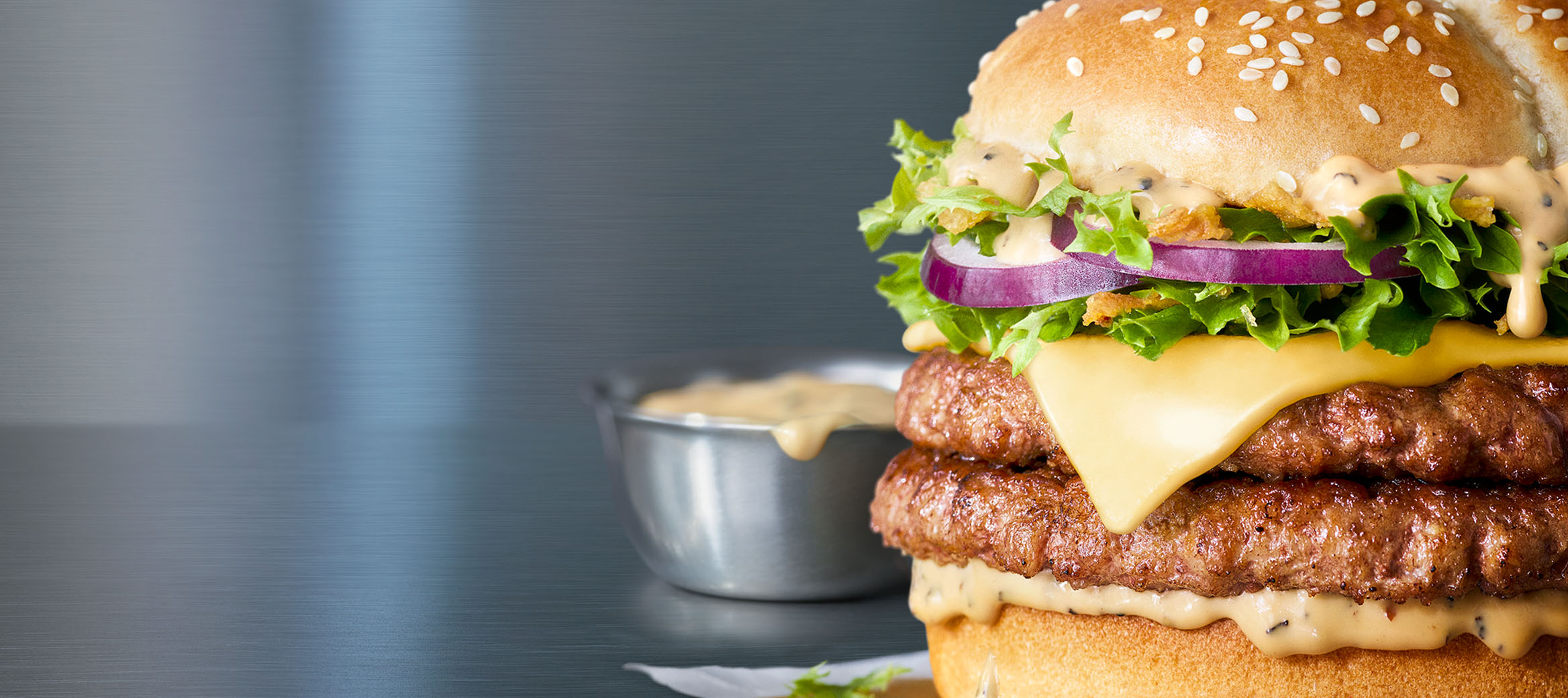 A McDonald’s burger on a metallic background.