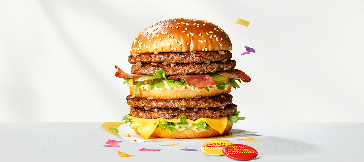 Double Big Mac® with Bacon with confetti on a silver metallic background.