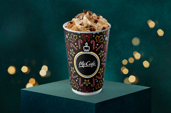 Galaxy® Caramel Hot Chocolate with a festive dark green background