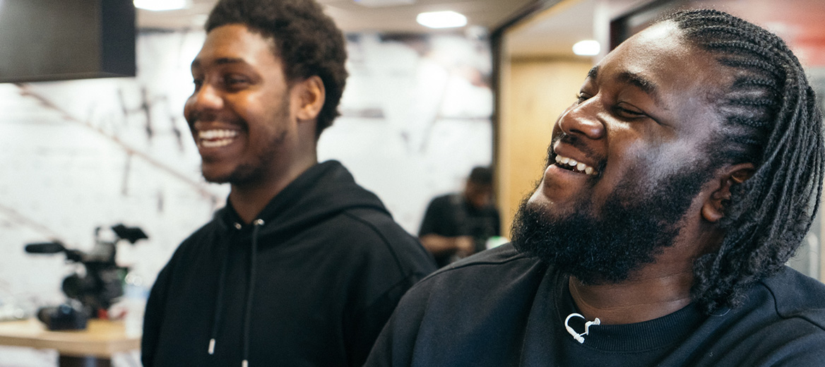 Youth workers smiling in a McDonald’s restaurant.