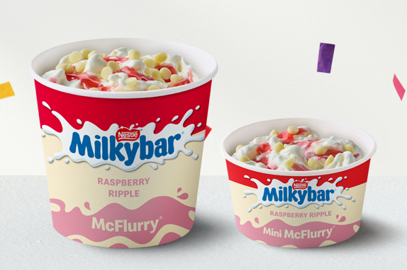 Milkybar® Raspberry Ripple McFlurry® with confetti on a silver metallic background.